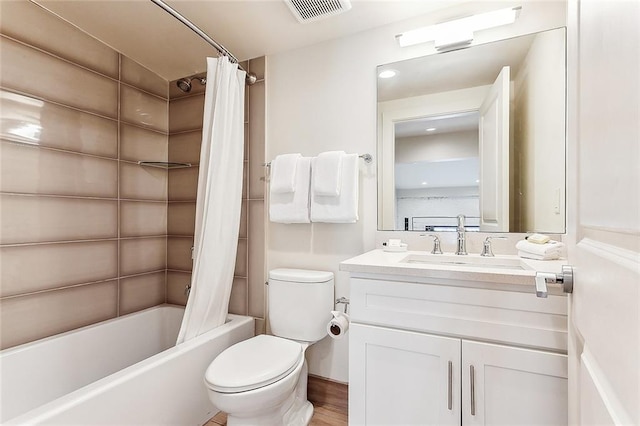 full bath featuring visible vents, shower / bath combination with curtain, toilet, and vanity