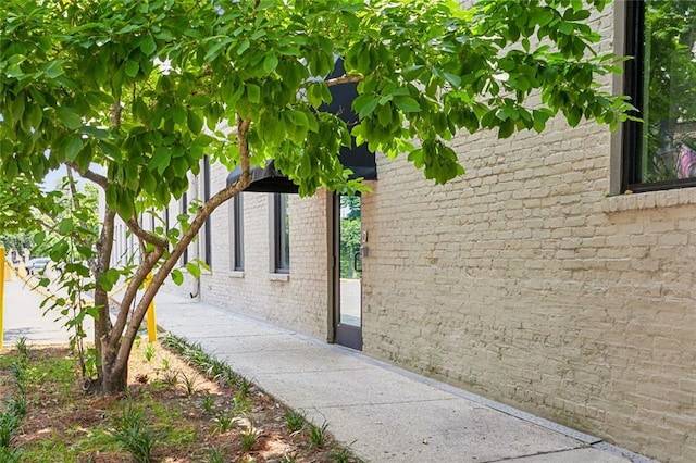 view of home's exterior with brick siding