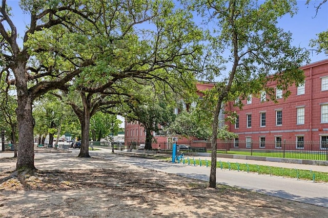 view of property's community with fence
