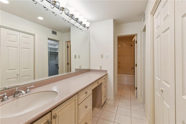 bathroom with tile patterned floors, vanity, and bathing tub / shower combination