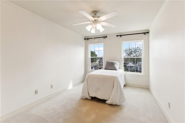 206 Rue Saint Peter St, Metairie, LA 70005 - bedroom featuring baseboards, a ceiling fan, and light colored carpet