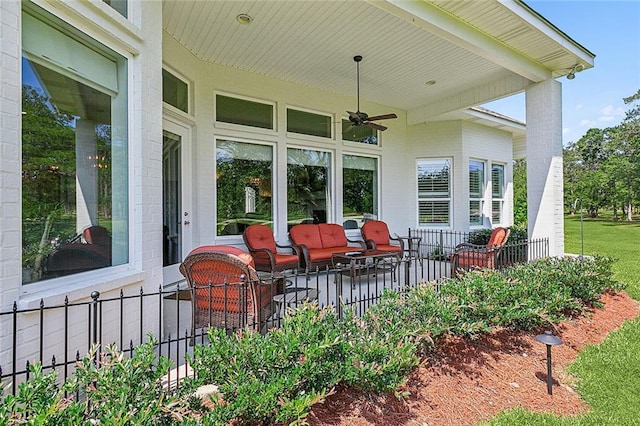 view of patio with ceiling fan and an outdoor hangout area