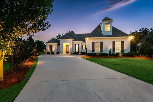 view of front of property with a yard