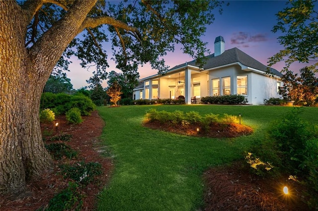 view of yard at dusk