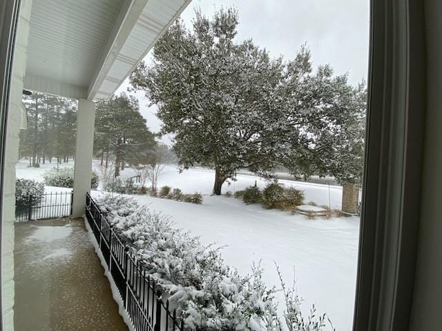 view of yard layered in snow