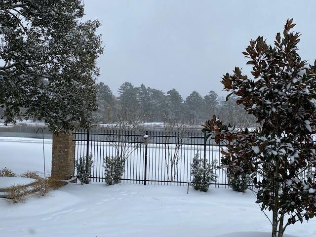 view of snow covered gate