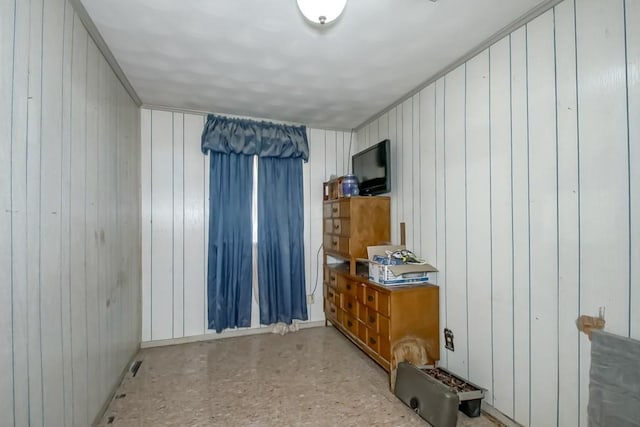 empty room featuring wooden walls