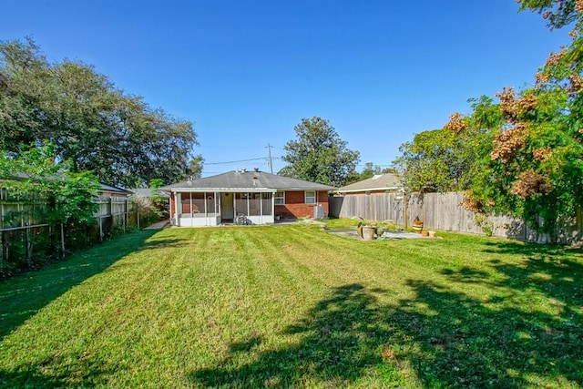 view of yard with a sunroom