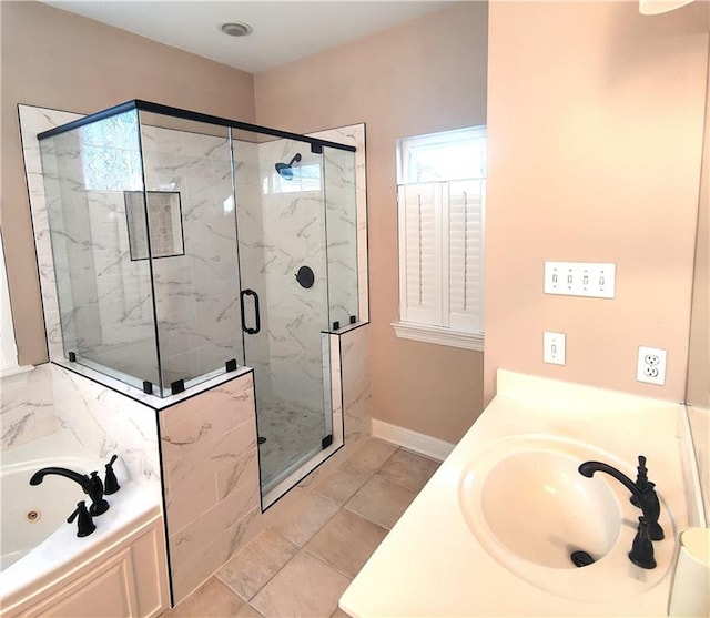 bathroom featuring tile patterned flooring, independent shower and bath, and vanity