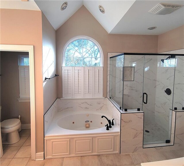 bathroom featuring toilet, tile patterned flooring, independent shower and bath, and lofted ceiling