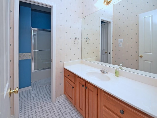 bathroom with walk in shower and vanity