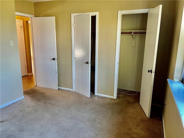 unfurnished bedroom featuring light colored carpet