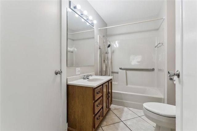 bathroom with tile patterned flooring, vanity, and toilet