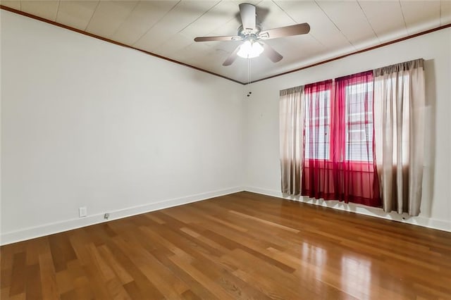 empty room with hardwood / wood-style flooring, ceiling fan, and ornamental molding