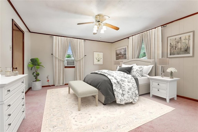 bedroom featuring light carpet, ceiling fan, and crown molding