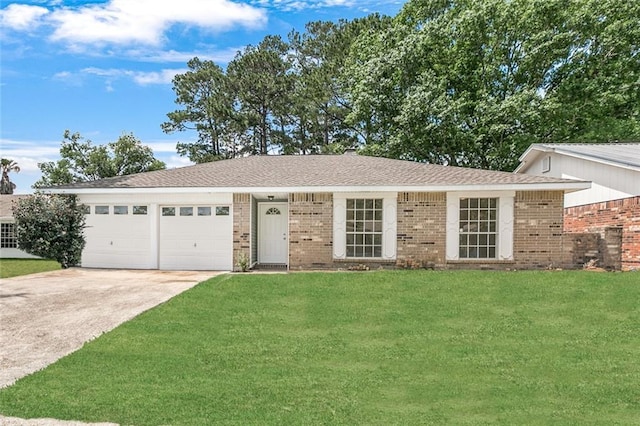 ranch-style home featuring a front yard and a garage