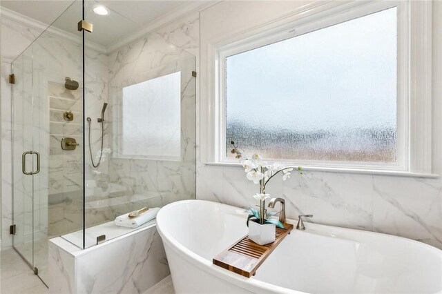 bathroom featuring crown molding, a wealth of natural light, and shower with separate bathtub