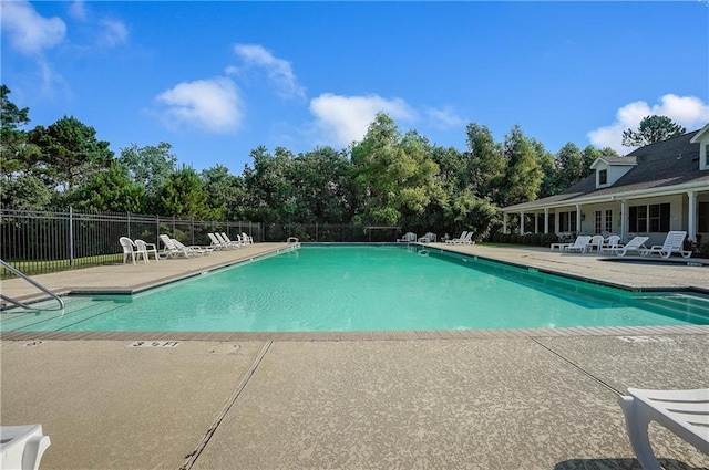 view of swimming pool with a patio area