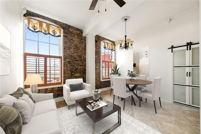 tiled living room featuring ceiling fan with notable chandelier, a barn door, and brick wall