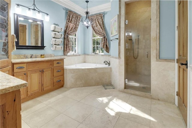 bathroom featuring tile patterned floors, vanity, independent shower and bath, and ornamental molding