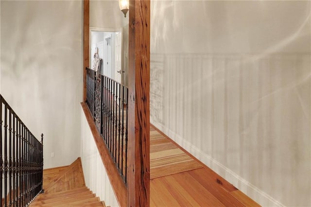 stairway featuring hardwood / wood-style flooring