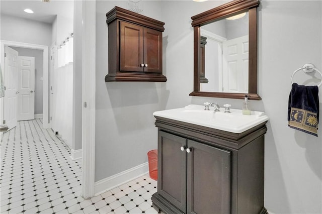 bathroom with tile patterned floors and vanity