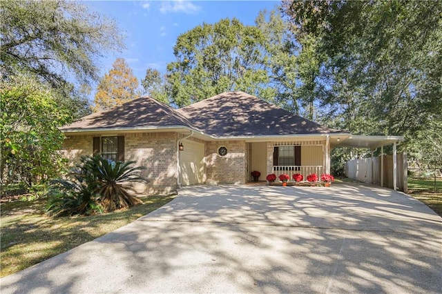 view of front of house featuring a porch and a carport