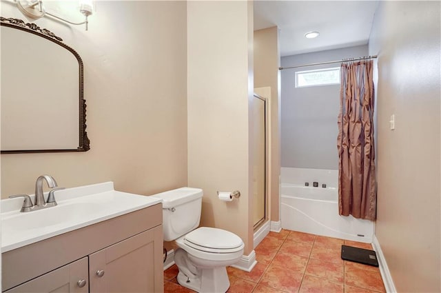 full bathroom featuring tile patterned floors, vanity, shower with separate bathtub, and toilet