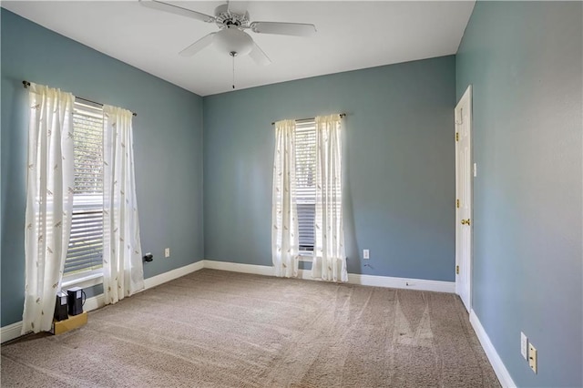 carpeted empty room with ceiling fan