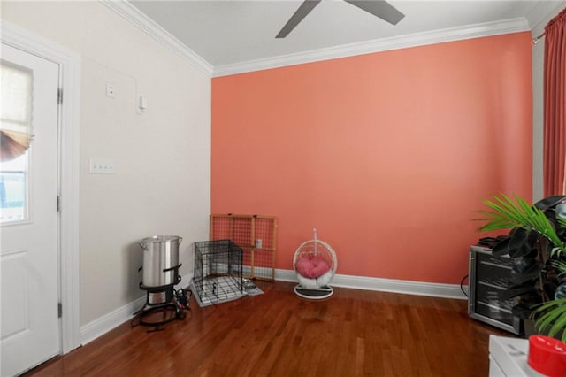 sitting room with ceiling fan, dark hardwood / wood-style floors, and ornamental molding