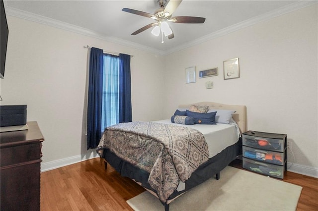 bedroom with wood-type flooring, ceiling fan, and ornamental molding