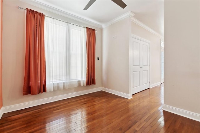6128 Campus Blvd, New Orleans, LA 70126 - unfurnished room featuring hardwood / wood-style floors, healthy amount of natural light, a ceiling fan, baseboards, and ornamental molding