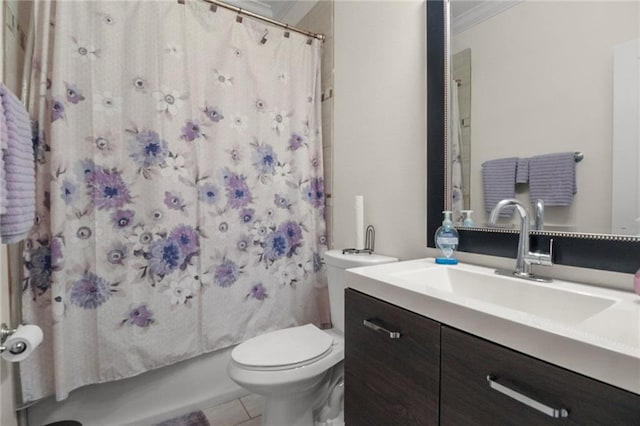 full bathroom featuring tile patterned floors, toilet, shower / bath combo with shower curtain, vanity, and ornamental molding