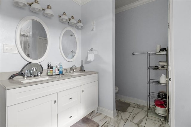 bathroom featuring crown molding, vanity, and toilet