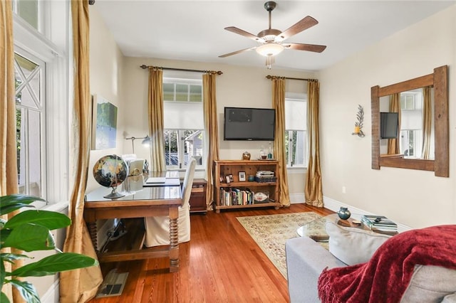 interior space with ceiling fan and hardwood / wood-style flooring