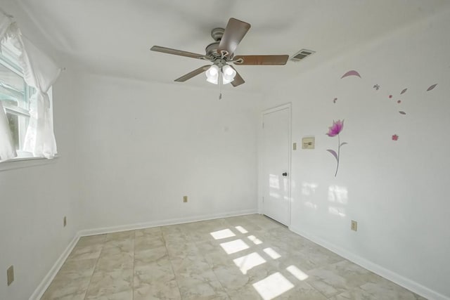 spare room with ceiling fan