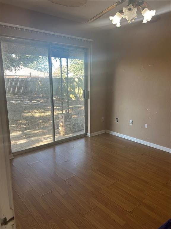 unfurnished room featuring dark wood-type flooring