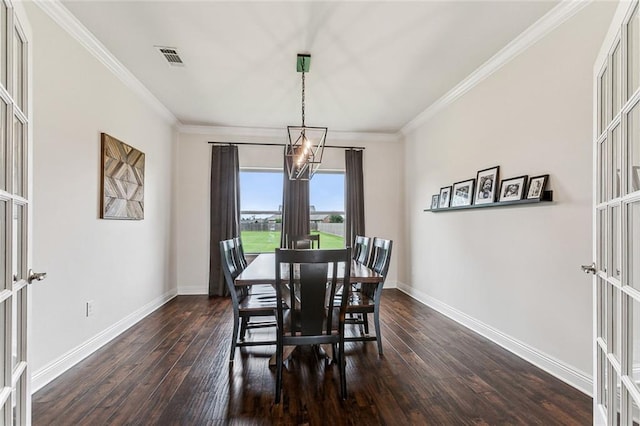 dining room with french doors, dark hardwood / wood-style floors, and ornamental molding