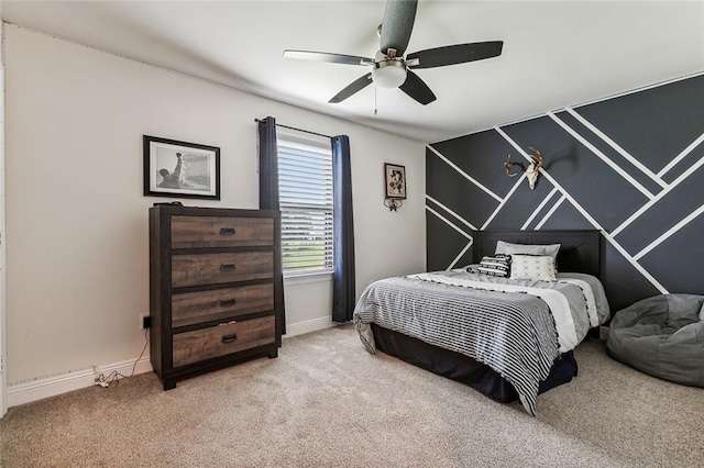 bedroom with ceiling fan and light colored carpet