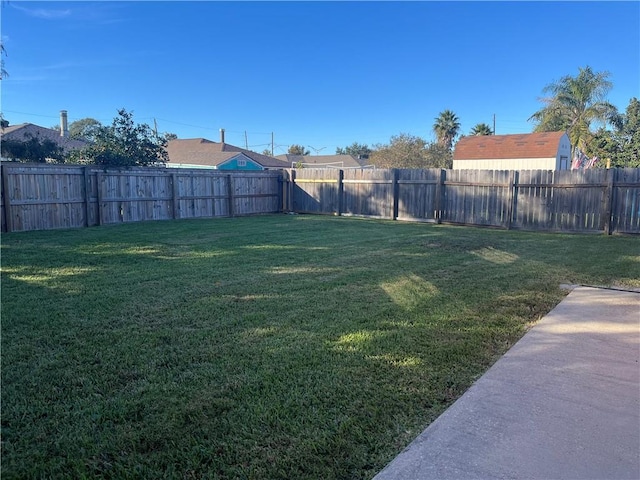 view of yard with a fenced backyard