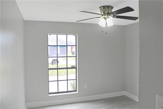 unfurnished room with light hardwood / wood-style flooring and ceiling fan