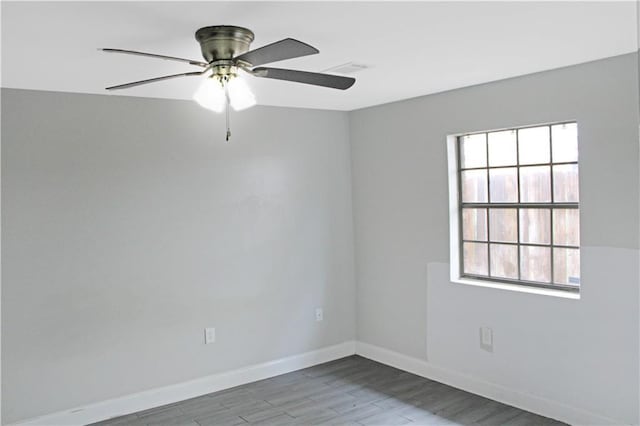 spare room featuring light wood-type flooring and ceiling fan