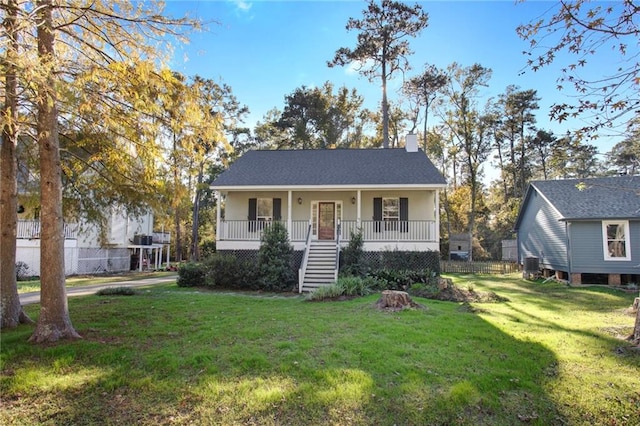 view of front facade with a porch and a front lawn