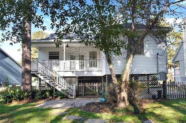 rear view of house featuring a porch