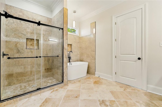 bathroom featuring tile walls, a freestanding tub, crown molding, and a shower stall