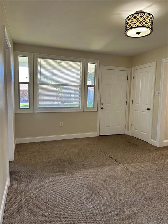 entrance foyer with carpet