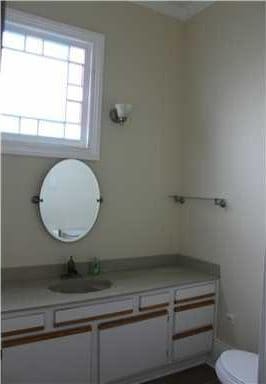 bathroom with vanity and toilet