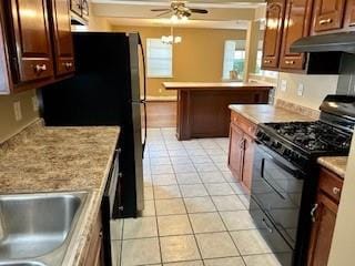 kitchen with light tile patterned flooring, ceiling fan, and black appliances