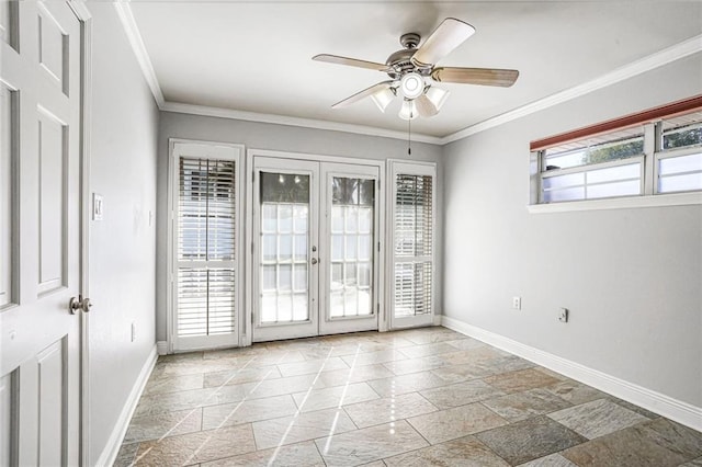 empty room with ceiling fan, ornamental molding, and a wealth of natural light