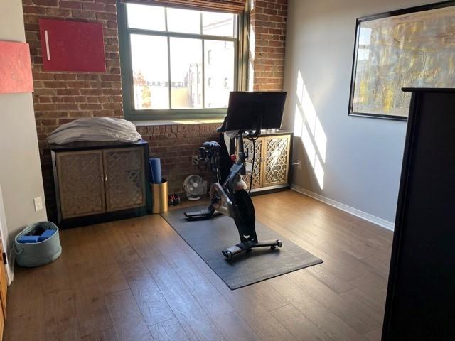 exercise area with wood-type flooring